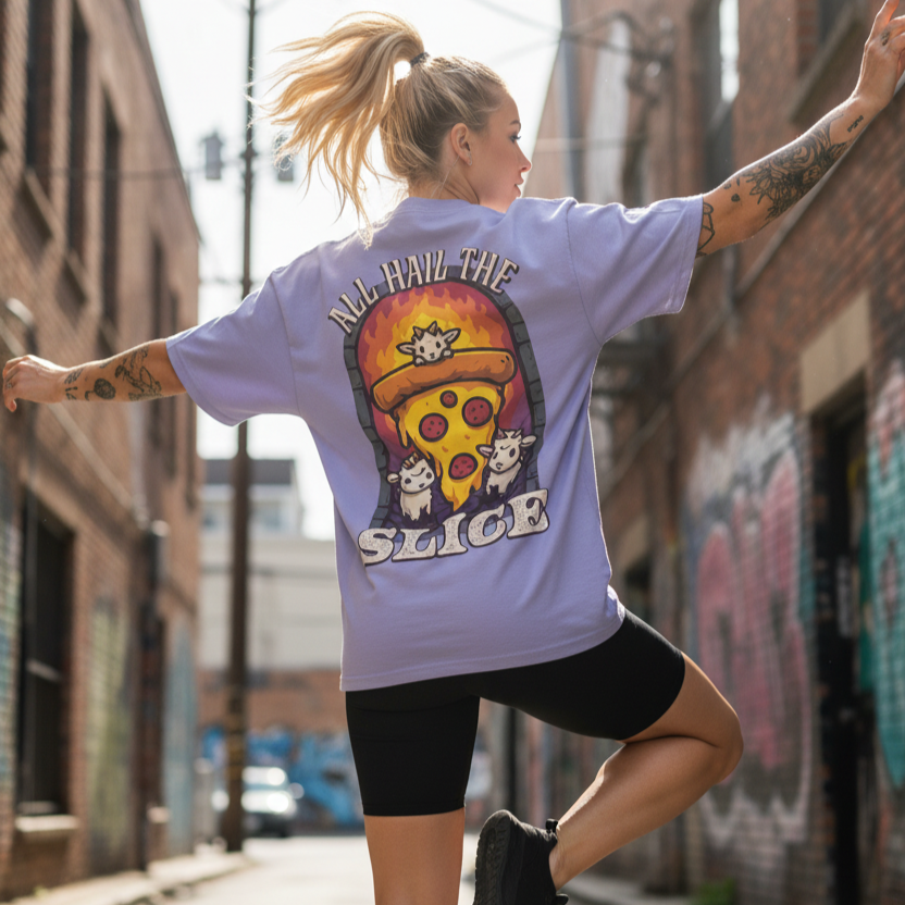 Woman wearing a unique design t-shirt with a graphic back print design and slogan in an urban setting
