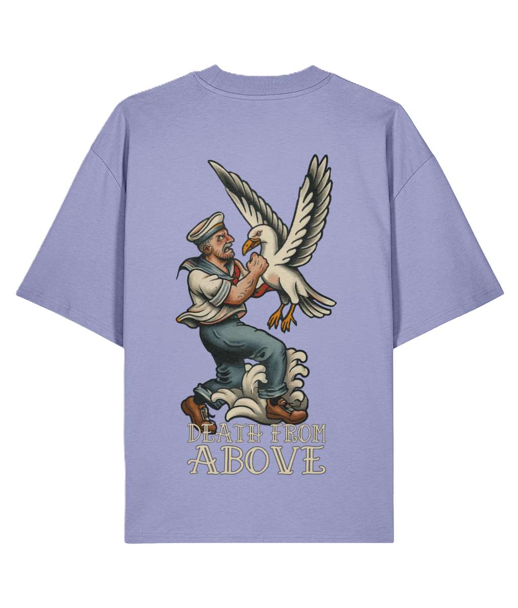 Violet t-shirt with a graphic tattoo design of a sailor and seagull on the back.
