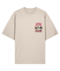 Beige oversized graphic t-shirt with a colorful rampaging through a city graphic design on a white background